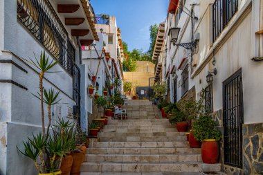 beautiful historic old colorful houses Barrio Santa Cruz Alicante Spain on a sunny day