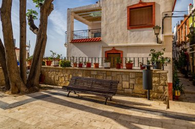 beautiful historic old colorful houses Barrio Santa Cruz Alicante Spain on a sunny day