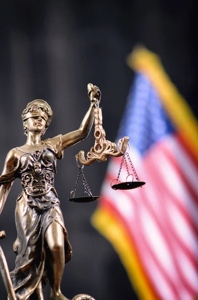 Law and Justice, Legality concept, Scales of Justice, Justitia, Lady Justice in front of the American flag in the background.