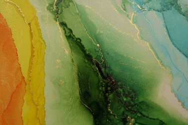 Abstract green, yellow, gold glitter flow wave blots painting background. Watercolor and Alcohol ink colors. Marble texture.