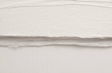 Empty crumpled wet canvas fabric blank texture copy space wave background. Gray beige  color.