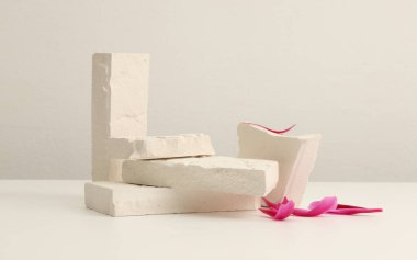 Stones platform podium on beige background. Minimal empty display product presentation scene. 
