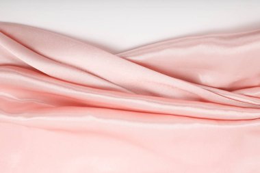 Pembe nacre dalga kumaş ipeği. Soyut doku yatay kopyalama alanı arkaplanı.