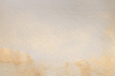Soft wet watercolor paper texture blot painting wall. Abstract nacre silver, gold, beige marble copy space background.