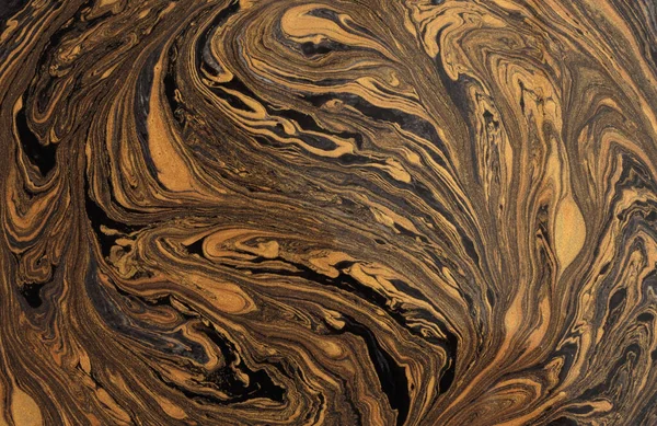 Art flow pour wave oil and acrylic color painting blot wall. Abstract swirl black and gold texture background.