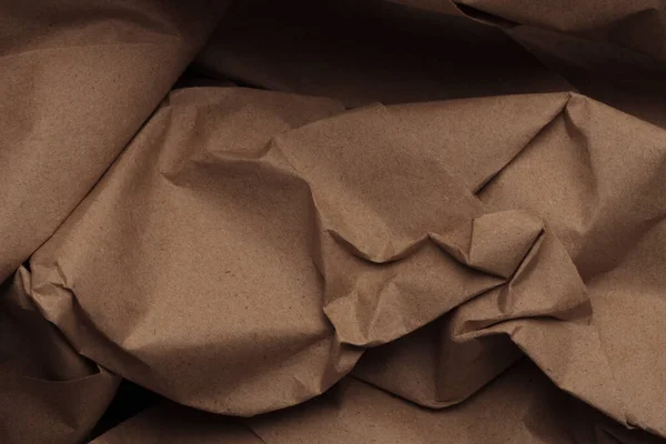 Brown beige crumpled package old craft paper blank texture copy space background.