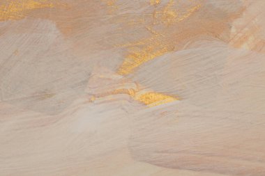 Dokulu yağ ve akrilik leke bezi duvar boyası. Soyut altın rengi, bej rengi fırça darbesi arka planı.