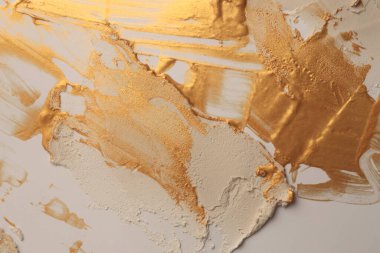 Sanat yağı ve akrilik leke bezi duvar boyası. Soyut doku pastel bej, altın rengi boya fırça darbesi rahatlama dokusu arka plan.