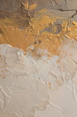 Sanat yağı ve akrilik leke bezi duvar boyası. Soyut desen bronz, bej, altın rengi fırça darbesi destek dokusu arka planı