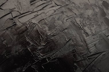 Sanat yağı ve akrilik leke bezi duvar boyası. Soyut doku siyah renk lekesi fırça darbesi rahatlama dokusu arka planı