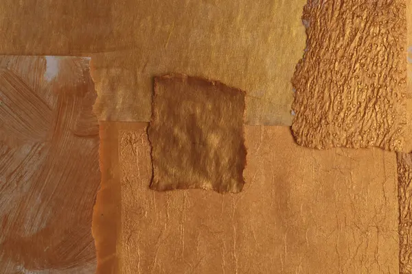 Gold, bronze and beige paper collage paper frame painting wall. Abstract glow texture copy space relief background.