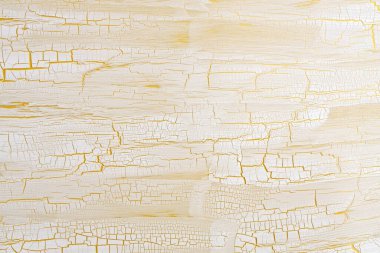 Craquelure scratch crack relief texture painting stucco wall background. White beige, yellow color. clipart