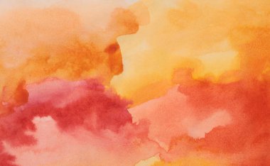 Islak kağıt desenli arka planda mürekkep rengi el boyası lekesi çizilmiş. Turuncu, Sarı renk.