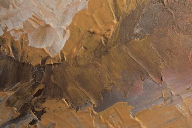 Bronz, altın rengi kirli sanat yağı ve akrilik leke bezi kaplama duvar boyası. Soyut doku lekesi fırça darbesi rahatlama dokusu arka planı