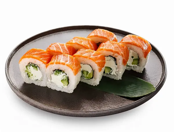sushi roll on a white plate isolated on white background, top view.