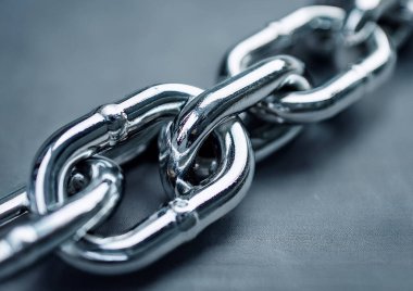 chain of different sizes on grey background