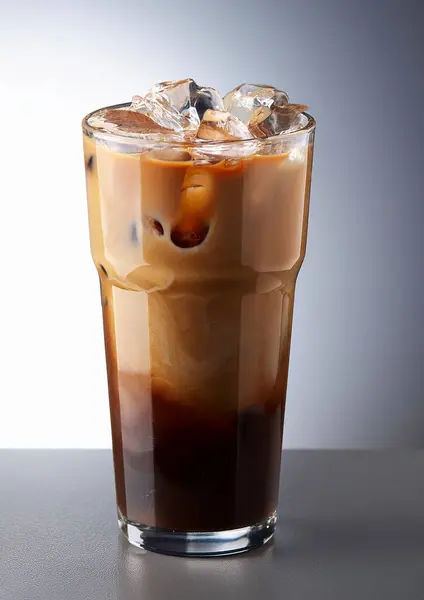 iced coffee with milk on grey clear background