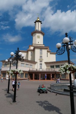 UKRAINE, IVANO-FRANKIVSK, AUGUST 21, 2012: People near Ratusha or Town Hall in Ivano-Frankivsk city, Ukraine. Building in art deco style in center of Ivano-Frankivsk city on Rynok or Market Square