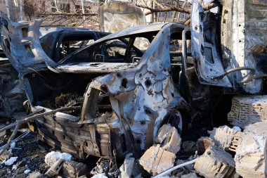 After bombing. Cars burned by russian missile in Kyiv city. War in Ukraine. Terror and genocide of Ukrainian people