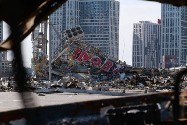 KYIV, UKRAINE, APRIL 15, 2022: Cars burned by russian missile. Missile destroyed shopping center Retroville on March 20. Terror and genocide of Ukrainian people. Russia - state of sponsor of terrorism