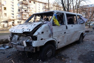 Russian missile destroyed minibus and damaged houses in Kyiv on March 18, 2022. After bombing, russian aggression, war in Ukraine, terror and genocide of Ukrainian people