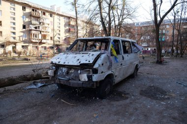 UKRAINE, KYIV, MARCH 20, 2022: Russian missile destroyed minibus and damaged houses in Kyiv on March 18, 2022.Russian aggression, after bombing, war in Ukraine, terror and genocide of Ukrainian people