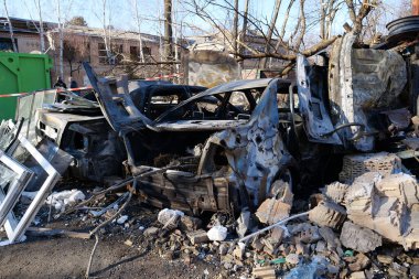 KYIV, UKRAINE, MARCH 20, 2022: After bombing. Cars burned by russian missile in Kyiv city on March 18, 2022. War in Ukraine. Russia - terrorist country. Terror and genocide of Ukrainian people