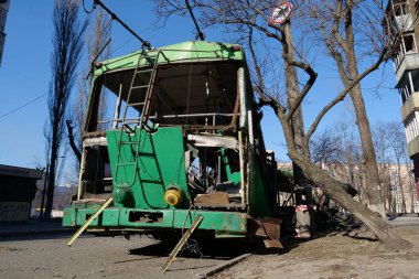 KYIV, UKRAINE, MARCH 20, 2022: After bombing. War in Ukraine. Russian missile destroyed trolleybus in Kyiv city on March 14, 2022. Terror and genocide of Ukrainian people