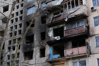 KYIV, UKRAINE, APRIL 15, 2022: After bombing. Russian terrorist army destroyed by shell dwelling house on Obolon district in Kyiv on March 2022. War in Ukraine. Terror and genocide of Ukrainian people