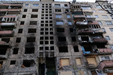 KYIV, UKRAINE, APRIL 15, 2022: After bombing. Russian terrorist army destroyed by shell dwelling house on Obolon district in Kyiv on March 2022. War in Ukraine. Terror and genocide of Ukrainian people