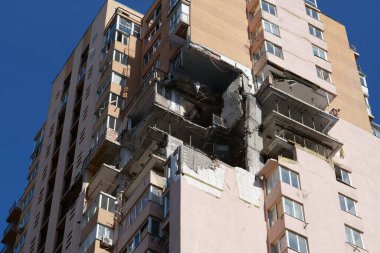 KYIV, UKRAINE, MAY 11, 2022: After bombing. War in Ukraine. Terror and genocide of Ukrainian people. Russian terrorists damaged by missile dwelling house in Kyiv on end of February 2022