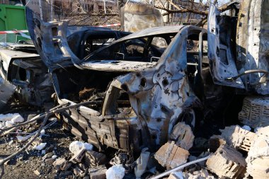 KYIV, UKRAINE, MARCH 20, 2022: After bombing. Cars burned by russian missile in Kyiv city on March 18, 2022. War in Ukraine. Russia - terrorist country. Terror and genocide of Ukrainian people