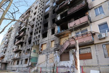 KYIV, UKRAINE, APRIL 15, 2022: After bombing. Russian terrorist army destroyed by shell dwelling house on Obolon district in Kyiv on March 2022. War in Ukraine. Terror and genocide of Ukrainian people