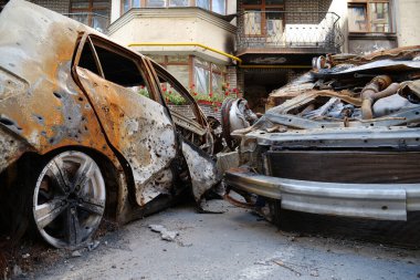 IRPIN, UKRAINE, JUNE 6, 2022: After bombing. Russian terrorist army burned cars, dwelling houses and killed people in Irpin town, Kyiv Oblast on March 2022. Terror and genocide of Ukrainian people