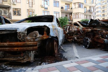 IRPIN, UKRAINE, JUNE 6, 2022: After bombing. Russian terrorist army burned cars, dwelling houses and killed people in Irpin town, Kyiv Oblast on March 2022. Terror and genocide of Ukrainian people