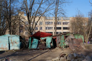 UKRAINE, KYIV, MARCH 20, 2022: Russian missile destroyed houses and garages in residential area in Kyiv city on March 18, 2022. After bombing, war in Ukraine, terror and genocide of Ukrainian people