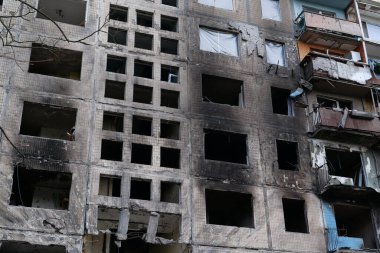 KYIV, UKRAINE, APRIL 15, 2022: After bombing. Russian terrorist army destroyed by shell dwelling house on Obolon district in Kyiv on March 2022. War in Ukraine. Terror and genocide of Ukrainian people