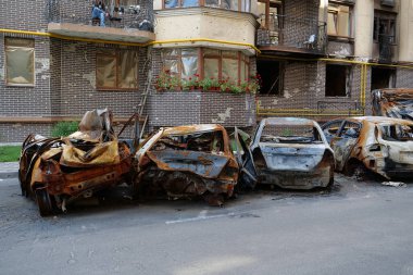 IRPIN, UKRAINE, JUNE 6, 2022: After bombing. Russian terrorist army burned cars, dwelling houses and killed people in Irpin town, Kyiv Oblast on March 2022. Terror and genocide of Ukrainian people