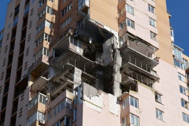 KYIV, UKRAINE, MAY 11, 2022: Russian missile damaged multi-storey dwelling building in Kiev city on February 26, 2022. Russian aggression. War in Ukraine. Terror and genocide of Ukrainian people
