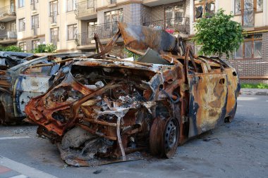 IRPIN, UKRAINE, JUNE 6, 2022: After bombing. Russian terrorist army burned cars, dwelling houses and killed people in Irpin town, Kyiv Oblast on March 2022. Terror and genocide of Ukrainian people