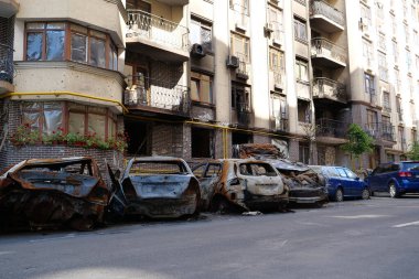 IRPIN, UKRAINE, JUNE 6, 2022: After bombing. Russian terrorist army burned cars, dwelling houses and killed people in Irpin town, Kyiv Oblast on March 2022. Terror and genocide of Ukrainian people