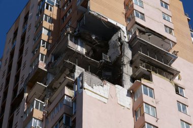 KYIV, UKRAINE, MAY 11, 2022: After bombing. War in Ukraine. Terror and genocide of Ukrainian people. Russian terrorists damaged by missile dwelling house in Kyiv on end of February 2022