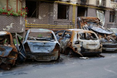 IRPIN, UKRAINE, JUNE 6, 2022: After bombing. Russian terrorist army burned cars, dwelling houses and killed people in Irpin town, Kyiv Oblast on March 2022. Terror and genocide of Ukrainian people