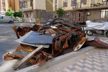 IRPIN, UKRAINE, JUNE 6, 2022: After bombing. Russian terrorist army burned cars, dwelling houses and killed people in Irpin town, Kyiv Oblast on March 2022. Terror and genocide of Ukrainian people
