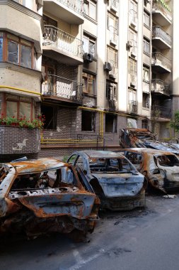 IRPIN, UKRAINE, JUNE 6, 2022: After bombing. Russian terrorist army burned cars, dwelling houses and killed people in Irpin town, Kyiv Oblast on March 2022. Terror and genocide of Ukrainian people