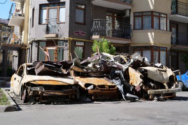 IRPIN, UKRAINE, JUNE 6, 2022: After bombing. Russian terrorist army burned cars, dwelling houses and killed people in Irpin town, Kyiv Oblast on March 2022. Terror and genocide of Ukrainian people