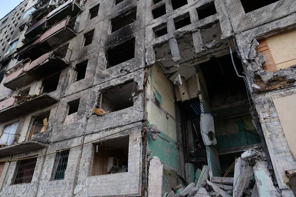 KYIV, UKRAINE, APRIL 15, 2022: After bombing. Russian terrorist army destroyed by shell dwelling house on Obolon district in Kyiv on March 2022. War in Ukraine. Terror and genocide of Ukrainian people