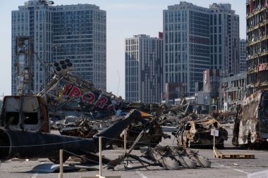 KYIV, UKRAINE, APRIL 15, 2022: Cars burned by russian missile. Missile destroyed shopping center Retroville on March 20. Terror and genocide of Ukrainian people. Russia - state of sponsor of terrorism