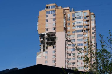 KYIV, UKRAINE, MAY 11, 2022: Russian missile damaged multi-storey dwelling building in Kiev city on February 26, 2022. Russian aggression. War in Ukraine. Terror and genocide of Ukrainian people