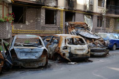 IRPIN, UKRAINE, JUNE 6, 2022: After bombing. Russian terrorist army burned cars, dwelling houses and killed people in Irpin town, Kyiv Oblast on March 2022. Terror and genocide of Ukrainian people